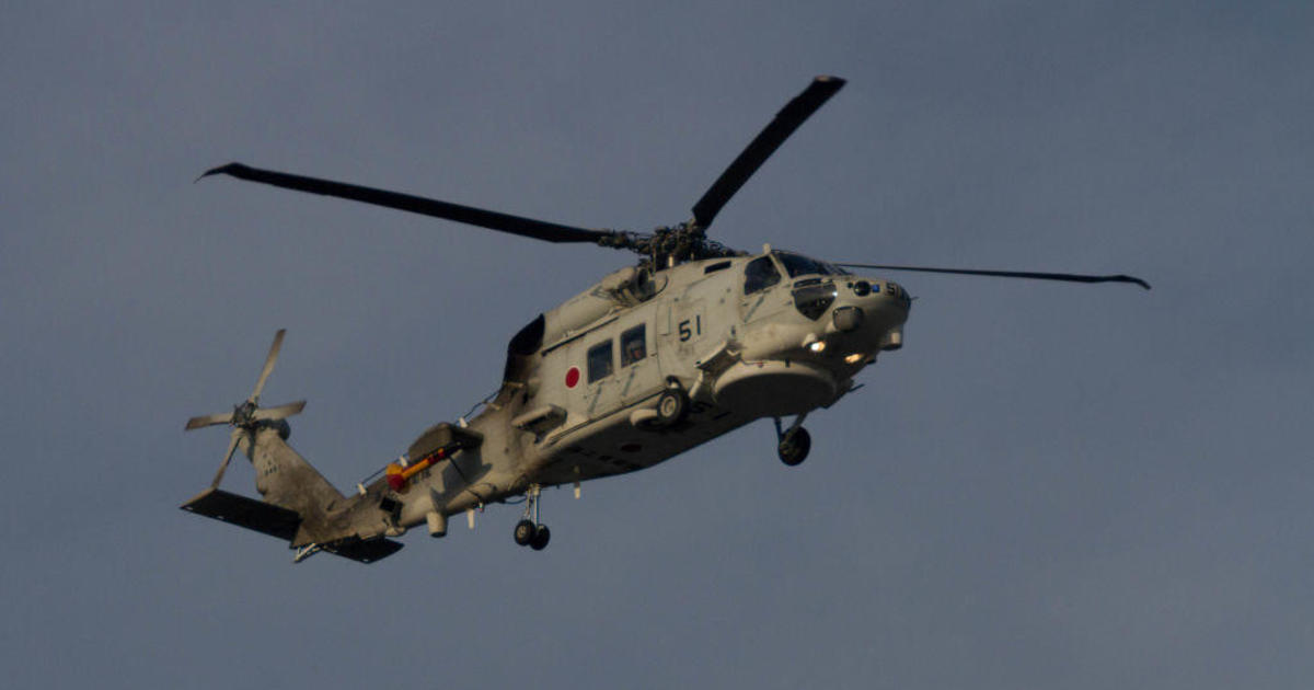 One dead and seven missing after two Japanese naval helicopters crashed in the Pacific Ocean