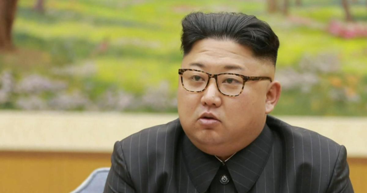 North Korean leader Kim Jong Un oversees the final test of a new multiple rocket launcher