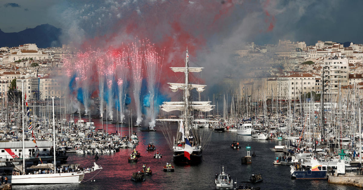 The Olympic flame reaches France for the 2024 Paris Olympics aboard a 19th-century sailing ship