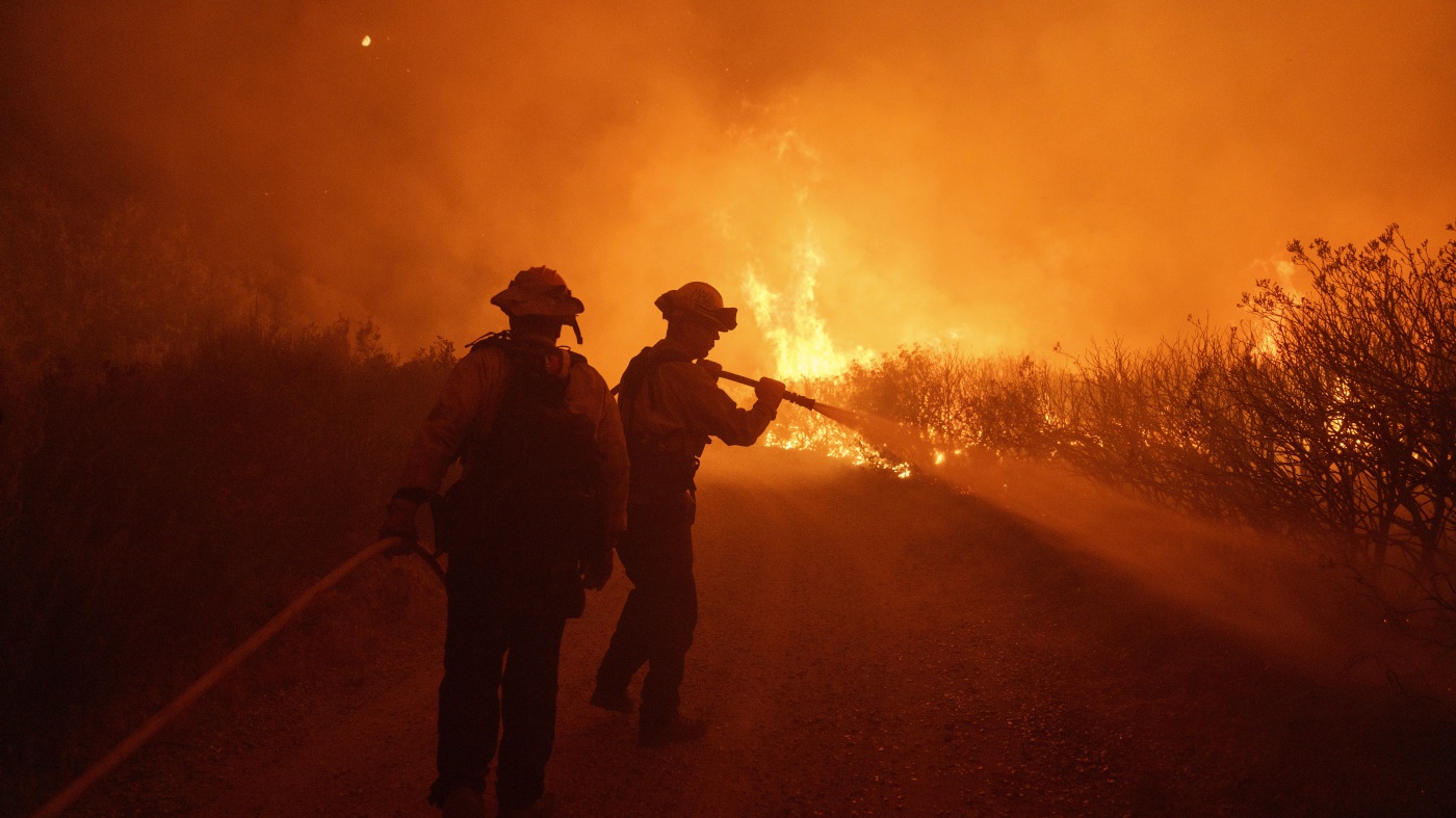 A fast-moving wildfire spreads north of Los Angeles, forcing evacuations: NPR